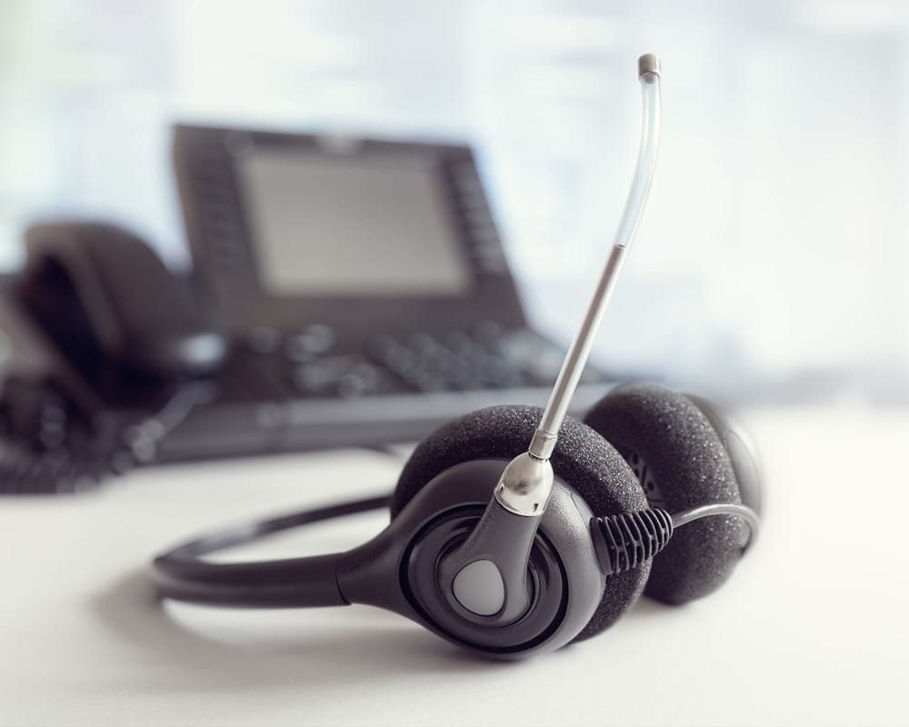 Phone headset sitting on a desk